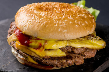 burger with steak and flowing sauces