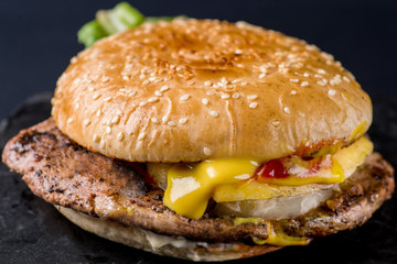 burger with steak and flowing sauces