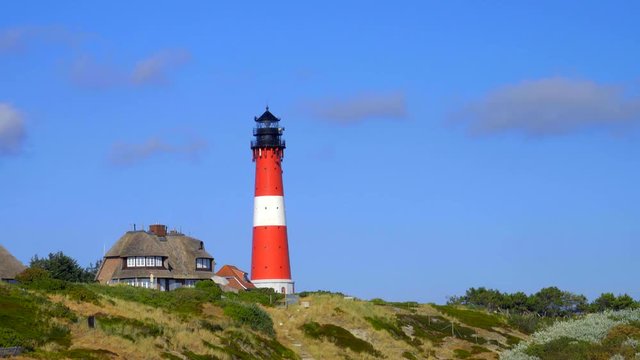 Leuchtturm H&ouml;rnum Sylt mit D&uuml;nen Landschaft  und Strand