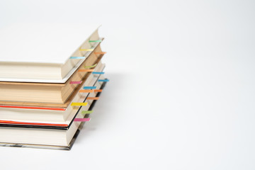 close up of book marked with placeholders on white background.