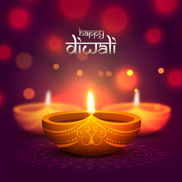 Indian Festival Diwali celebration with illustration of realistic oil lamp on blurred bokeh background can be used as greeting card design.