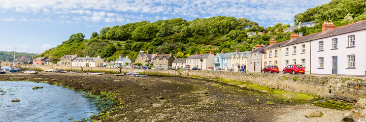 Fototapeta na wymiar View on the harbor of Fishguard lower town during low tide on he coast of Pembrokeshire, in Wales, UK