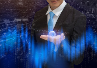 Global business man holding earth planet. on hands conceptual.
