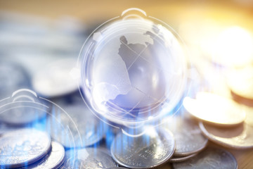 Gold Globe with many gold coins around..