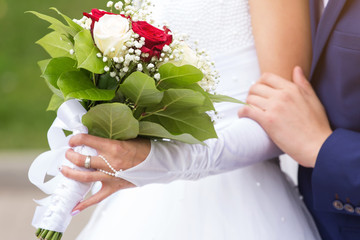 Wedding bouquet in the bride hands. Newlywed, marriage