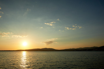 Golden sunset on the sea. Path on the water. Beautiful Golden light