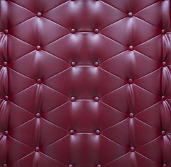 Pattern of dark red leather seat upholstery use for background.