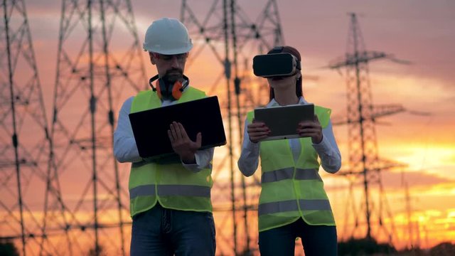 Female Engineer Wearing VR Headset managing construction project. Futuristic Virtual Reality concept.