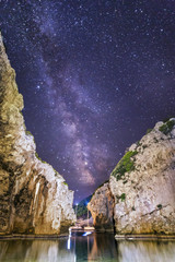 Milky way star galaxy space night landscape by the sea coast beach at Stiniva bay, island Vis, Croatia