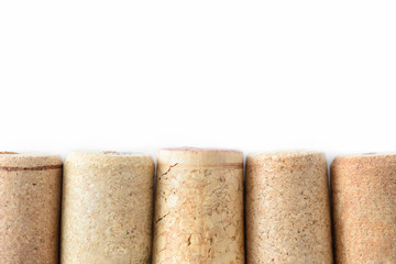 Pile of assorted used wine corks isolated on white background. Close up view.