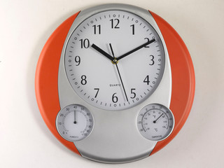 Wall clock, round shaped, on white background