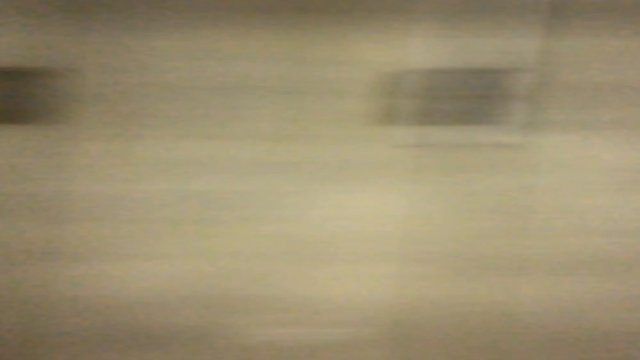 Uhd Footage :  Out side view of Underground train run through the tunnel . The tunnel wall and illuminate light