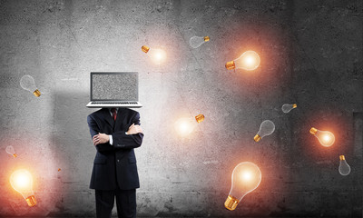 Businessman with laptop instead of head.