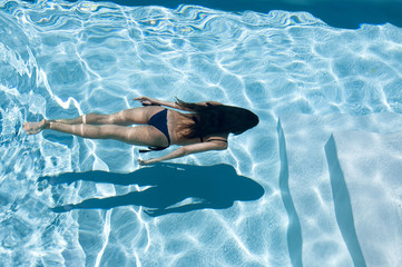 woman swims underwater