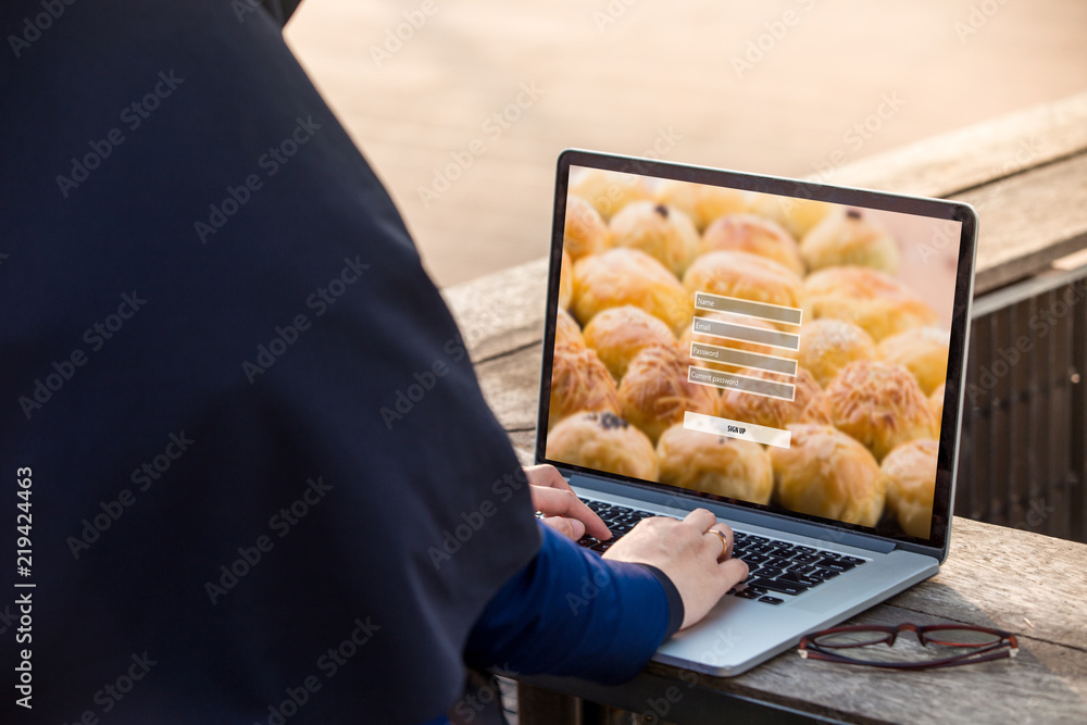 Poster hijab woman is working using laptop doing sign up username password log in protection on screen at o