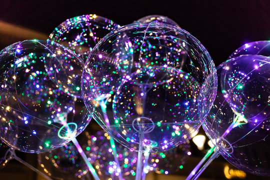 LED transparent balloon with multi-colored luminous garland