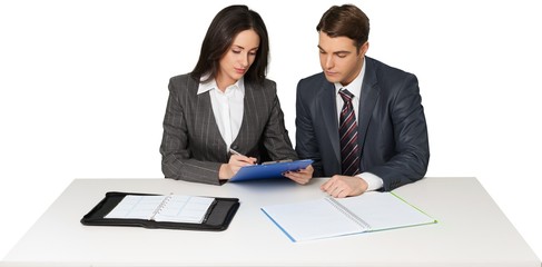 Coworkers Working at Desk and Writing on Clipboard - Isolated