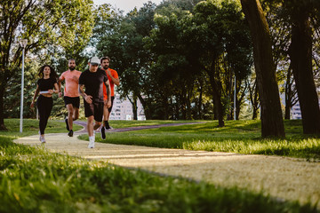 Group of people running in the park