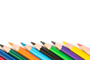 Color pencils in row isolated on white background.