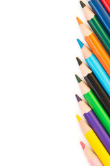 Color pencils in row isolated on white background.