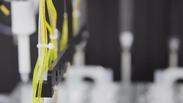 Close-up of the robot in the laboratory injects the drug catalyst for analysis into the test tube