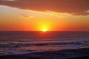 Crimson Tropical Sunset over Pacific Ocean Waves