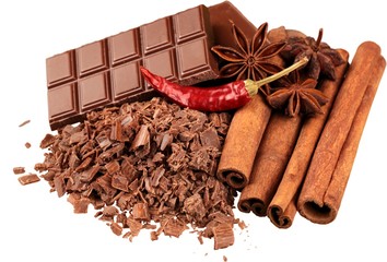 Cinnamon sticks and stars anise with chocolat isolated on white