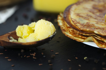 Pancakes and spoon  butter close up