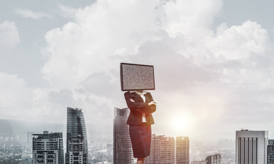 Business woman with TV instead of head.