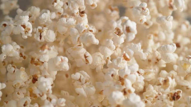Popcorn tossed up and falling down. Shot with high speed camera, phantom flex 4K. Slow Motion.