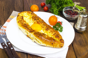 Adjarian khachapuri. Georgian traditional  national cheese  bread with egg