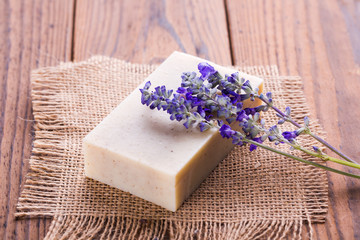 Obraz na płótnie Canvas Homemade Soap with Lavender Flowers on Table