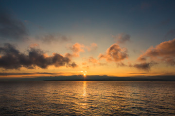 Golden Sunrise behind Alps Mountains and over Lake Leman.