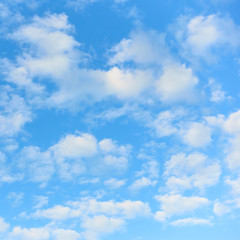 Naklejka na ściany i meble Light blue sky with white clouds