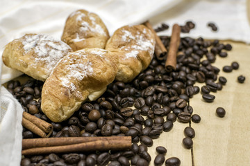 Coffee and croissants for breakfast. Wooden background