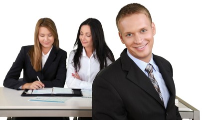 Fototapeta premium Happy Businessman with Colleagues in the Background - Isolated