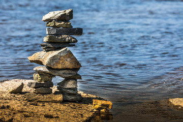 Inukshuk by the river edge.