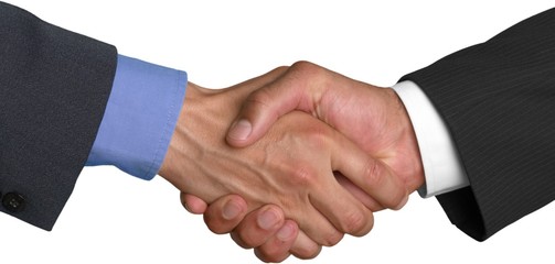 Closeup of Two Businessmen Shaking Hands