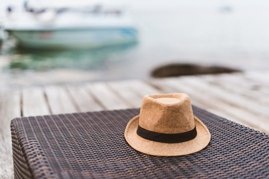 The Hat On The Seat, Which Has The Sea And Sky As The Background