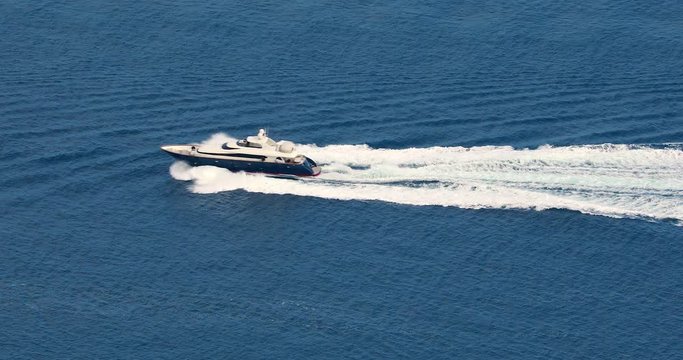 Aerial View Of A Fast Luxury Yacht With Splash And Wake On Mediterranean Sea
