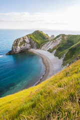 Man of War Beach on West Lulworth Cove and Durdle Door at Sunset.