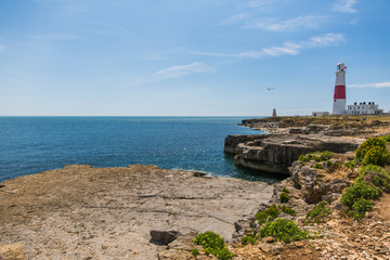 Portland Bill Lighthouse on a Bright Sunny Day with Blue Sky and Sea.