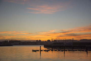 Photo of a sunset with sea, sky and sunlight