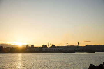 Fototapeta premium Photo of a sunset with sea, sky and sunlight