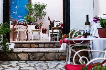 Tables of restaurants at Colorful streets of Parga, Greece