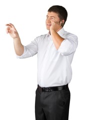 Fototapeta premium Portrait of young man in white shirt holding phone isolated on