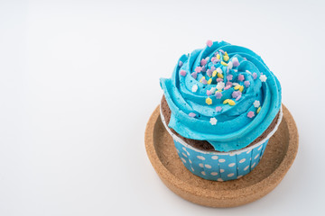 Fototapeta na wymiar Tasty colorful cupcake isolated on white background, close up.