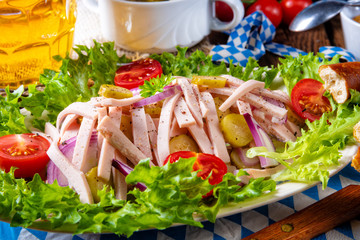 delicious bavarian sausage salad with onion and cucumbers