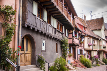 Fototapeta na wymiar 07/15/2018 Eguishem France. Colored half timbered houses in Eguishem Alsace France.
