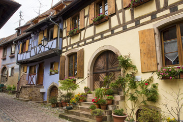 Fototapeta na wymiar 07/15/2018 Eguishem France. Colored half timbered houses in Eguishem Alsace France.